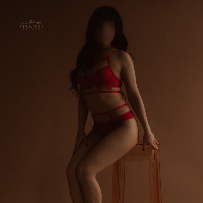 Island's Finest Trinity island's finest escort trinity sexy and cute perched on stool wearing red hot strappy lingerie 650